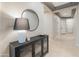 Bright and welcoming hallway with decorative lighting, high ceilings, and stylish furniture at 4141 E Morrison Ranch Pkwy, Gilbert, AZ 85296