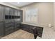 Functional home office featuring custom cabinetry, a built-in desk, and ample storage at 4141 E Morrison Ranch Pkwy, Gilbert, AZ 85296