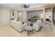 Spacious living room features tile floors, recessed lighting, and dual sofas creating an inviting atmosphere at 4141 E Morrison Ranch Pkwy, Gilbert, AZ 85296