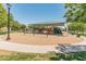 Community playground featuring swings, slides, and covered play area for children at 4141 E Morrison Ranch Pkwy, Gilbert, AZ 85296
