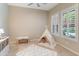 Bright playroom with neutral walls, plush rug, plantation shutters, and a fun teepee at 4141 E Morrison Ranch Pkwy, Gilbert, AZ 85296