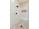 Shower room with stone floor, built in bench, and waterfall shower head at 4141 E Morrison Ranch Pkwy, Gilbert, AZ 85296
