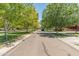 Picturesque street view lined with mature trees and well-maintained lawns in a quiet neighborhood at 4141 E Morrison Ranch Pkwy, Gilbert, AZ 85296