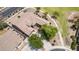 Overhead view of home featuring mature trees, desert landscaping, and an extended driveway leading to a spacious three-car garage at 41804 W Carlisle Ln, Maricopa, AZ 85138