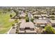 Aerial view of desert community with single-Gathering homes featuring tile roofs and mature landscaping at 41804 W Carlisle Ln, Maricopa, AZ 85138