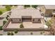 Rear of home with a tile roof and desert landscaping, complemented by an attached garage and a private backyard at 41804 W Carlisle Ln, Maricopa, AZ 85138