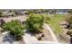 Aerial view showcasing a charming home near a park and a pond at 41804 W Carlisle Ln, Maricopa, AZ 85138
