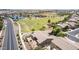 An aerial shot showcasing the home's location near a park, lake and other amenities at 41804 W Carlisle Ln, Maricopa, AZ 85138