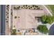 Overhead view of a desert home with mature, lush landscaping and a tile roof. Nearby walking path provides outdoor recreation at 41804 W Carlisle Ln, Maricopa, AZ 85138