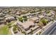 A high aerial perspective over a neighborhood with desert landscaping and tile roofed homes at 41804 W Carlisle Ln, Maricopa, AZ 85138
