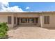 Backyard with desert landscaping and covered patio at 41804 W Carlisle Ln, Maricopa, AZ 85138