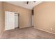 Bedroom featuring sliding closet doors and carpet at 41804 W Carlisle Ln, Maricopa, AZ 85138