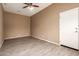 Cozy bedroom features a ceiling fan and wood-look flooring, offering a modern touch at 41804 W Carlisle Ln, Maricopa, AZ 85138