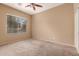 Bedroom featuring carpeted flooring and a window at 41804 W Carlisle Ln, Maricopa, AZ 85138
