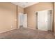 Bedroom featuring closet and doorways at 41804 W Carlisle Ln, Maricopa, AZ 85138