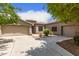 Well-maintained single-story home featuring a two-car garage and desert landscaping at 41804 W Carlisle Ln, Maricopa, AZ 85138