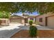 Charming single-story home with landscaped front yard and a two-car garage at 41804 W Carlisle Ln, Maricopa, AZ 85138
