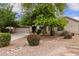 Inviting home with mature landscaping and a spacious driveway at 41804 W Carlisle Ln, Maricopa, AZ 85138