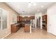 Charming kitchen featuring stainless steel appliances, breakfast bar, and ample cabinet space at 41804 W Carlisle Ln, Maricopa, AZ 85138
