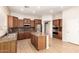 Well-appointed kitchen boasting stainless steel appliances, island, and lots of cabinet space at 41804 W Carlisle Ln, Maricopa, AZ 85138