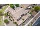 An aerial photograph shows the property's neutral tones, simple backyard and manicured desert landscaping at 41804 W Carlisle Ln, Maricopa, AZ 85138