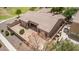 An aerial view showing the home's tile roof, covered patio, and desert landscaping at 41804 W Carlisle Ln, Maricopa, AZ 85138