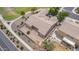 Aerial view of a well-maintained home with neutral stucco and desert landscaping in the backyard at 41804 W Carlisle Ln, Maricopa, AZ 85138