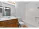 Bathroom featuring a vanity, toilet, mirror, and a shower with white tiling at 420 W Yukon Dr # 4, Phoenix, AZ 85027
