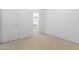 Bright carpeted bedroom with a door that leads to a walk in closet at 420 W Yukon Dr # 4, Phoenix, AZ 85027