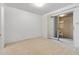 Bright carpeted bedroom featuring a sliding glass door to a patio at 420 W Yukon Dr # 4, Phoenix, AZ 85027