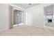 Carpeted bedroom with sliding glass door and fireplace at 420 W Yukon Dr # 4, Phoenix, AZ 85027