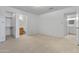 A bright bedroom featuring neutral carpet, a walk-in closet and an en-suite bathroom at 420 W Yukon Dr # 4, Phoenix, AZ 85027