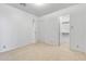 Bright carpeted bedroom with a door leading to a closet at 420 W Yukon Dr # 4, Phoenix, AZ 85027