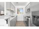 Modern kitchen with gray cabinets, stainless steel appliances, and tile flooring at 420 W Yukon Dr # 4, Phoenix, AZ 85027
