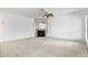 Open living area with fireplace, ceiling fan, and ample space at 420 W Yukon Dr # 4, Phoenix, AZ 85027