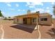 House's backyard has a covered patio and mature landscaping providing a relaxing retreat at 4202 E Brookwood Ct, Phoenix, AZ 85048