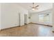 Bright bedroom with tile flooring, ceiling fan, and natural light from a window at 4202 E Brookwood Ct, Phoenix, AZ 85048