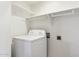 This laundry room features a washer and built-in shelving for convenient storage at 4202 E Brookwood Ct, Phoenix, AZ 85048