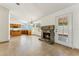 Living room with fireplace and direct access to a functional kitchen at 4202 E Brookwood Ct, Phoenix, AZ 85048