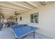 Back porch includes a ping pong table and lounge area at 4240 E Bluefield Ave, Phoenix, AZ 85032