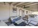 Extended back porch has comfortable outdoor seating and lighting at 4240 E Bluefield Ave, Phoenix, AZ 85032