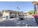 Spacious backyard features patio, mature trees, and gravel landscaping at 4240 E Bluefield Ave, Phoenix, AZ 85032