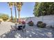 Gravel backyard includes mature trees, plants, and comfortable seating at 4240 E Bluefield Ave, Phoenix, AZ 85032