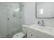 Modern bathroom featuring glass-enclosed shower, toilet, and vanity with sink and faucet at 4240 E Bluefield Ave, Phoenix, AZ 85032