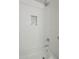 Bathroom features shower with white tiled walls and a built-in toiletry niche at 4240 E Bluefield Ave, Phoenix, AZ 85032