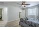 Clean, bright bedroom with ceiling fan, closet and comfortable bed with attractive gray pattern bedding at 4240 E Bluefield Ave, Phoenix, AZ 85032