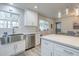 Bright kitchen features stainless steel appliances, white cabinetry, and an island at 4240 E Bluefield Ave, Phoenix, AZ 85032
