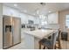 Modern kitchen with white cabinetry, stainless steel appliances, and a stylish center island at 4240 E Bluefield Ave, Phoenix, AZ 85032