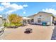 Expansive backyard featuring desert landscaping, covered patio and sitting areas at 4396 E Austin Ln, San Tan Valley, AZ 85140