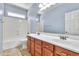 Bathroom featuring double sinks, a vanity, and a shower-tub combo at 4396 E Austin Ln, San Tan Valley, AZ 85140
